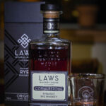 Laws Origins Cornerstone bottle with Poured Glass